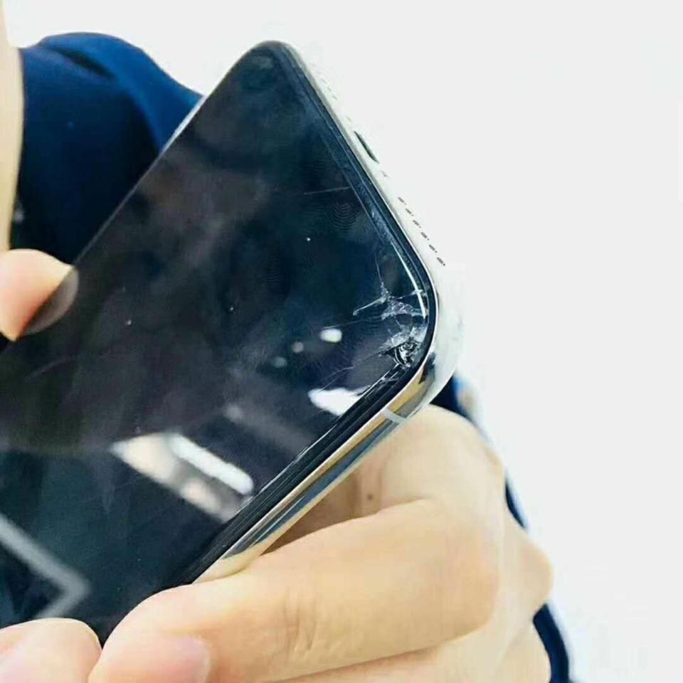 iPhone X with smashed corner
