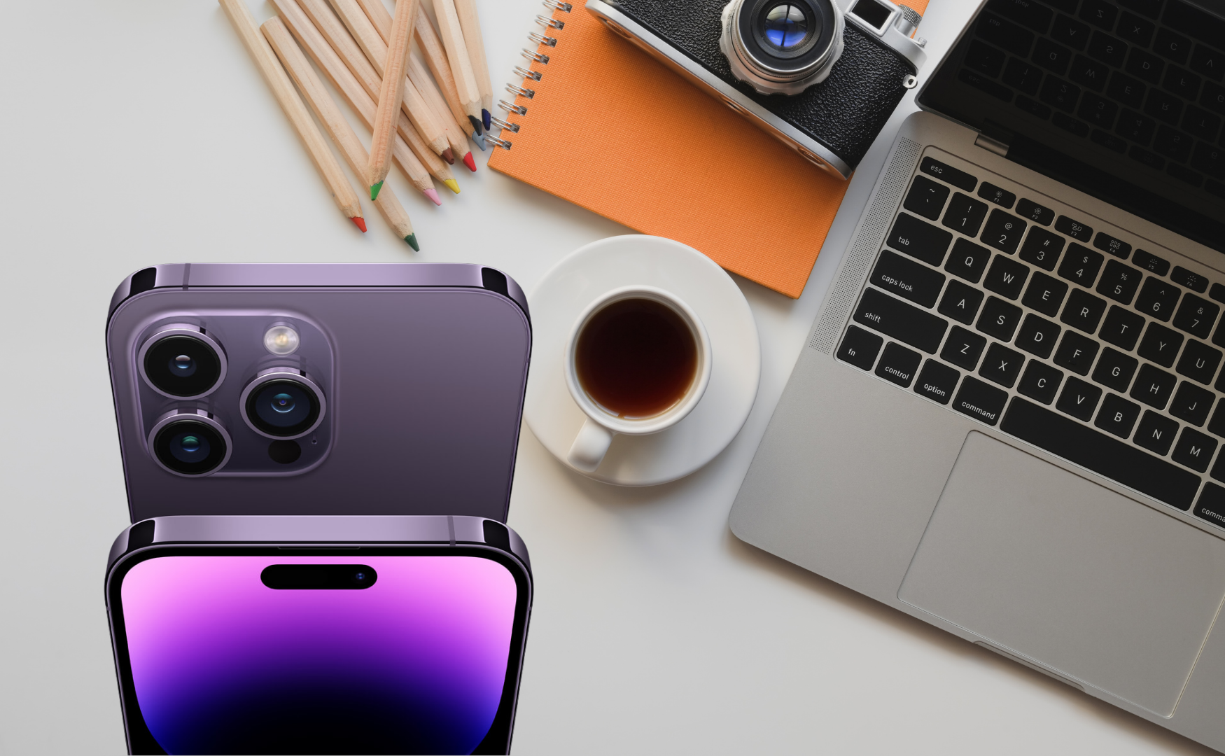 Iphone 14 pro colours: purple with artsy, creative desk background