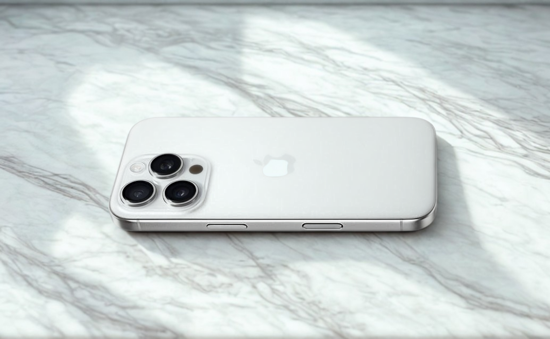 Iphone 16 pro colours: white titanium on a white marble floor