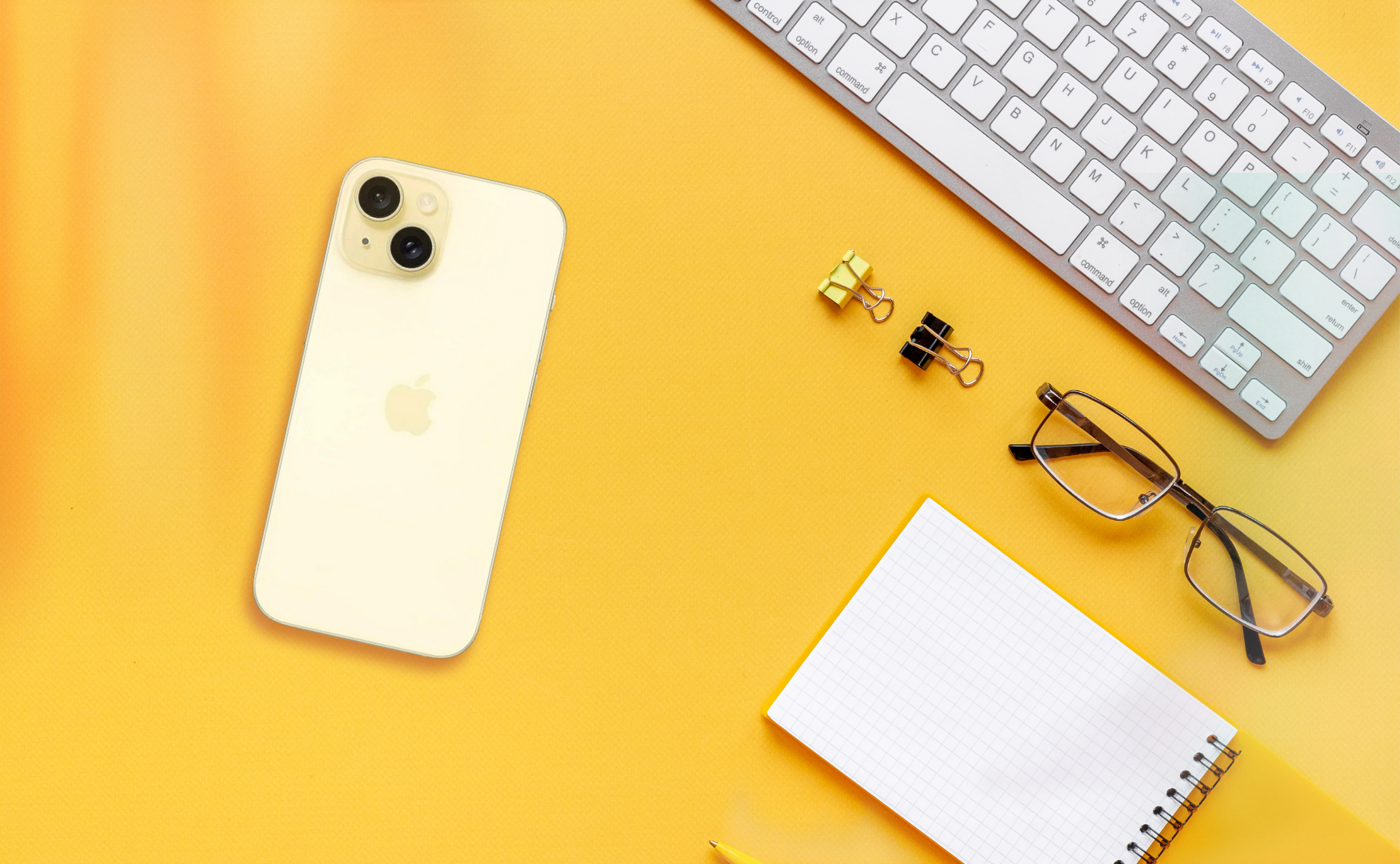 Iphone 15 colours: yellow on yellow desk