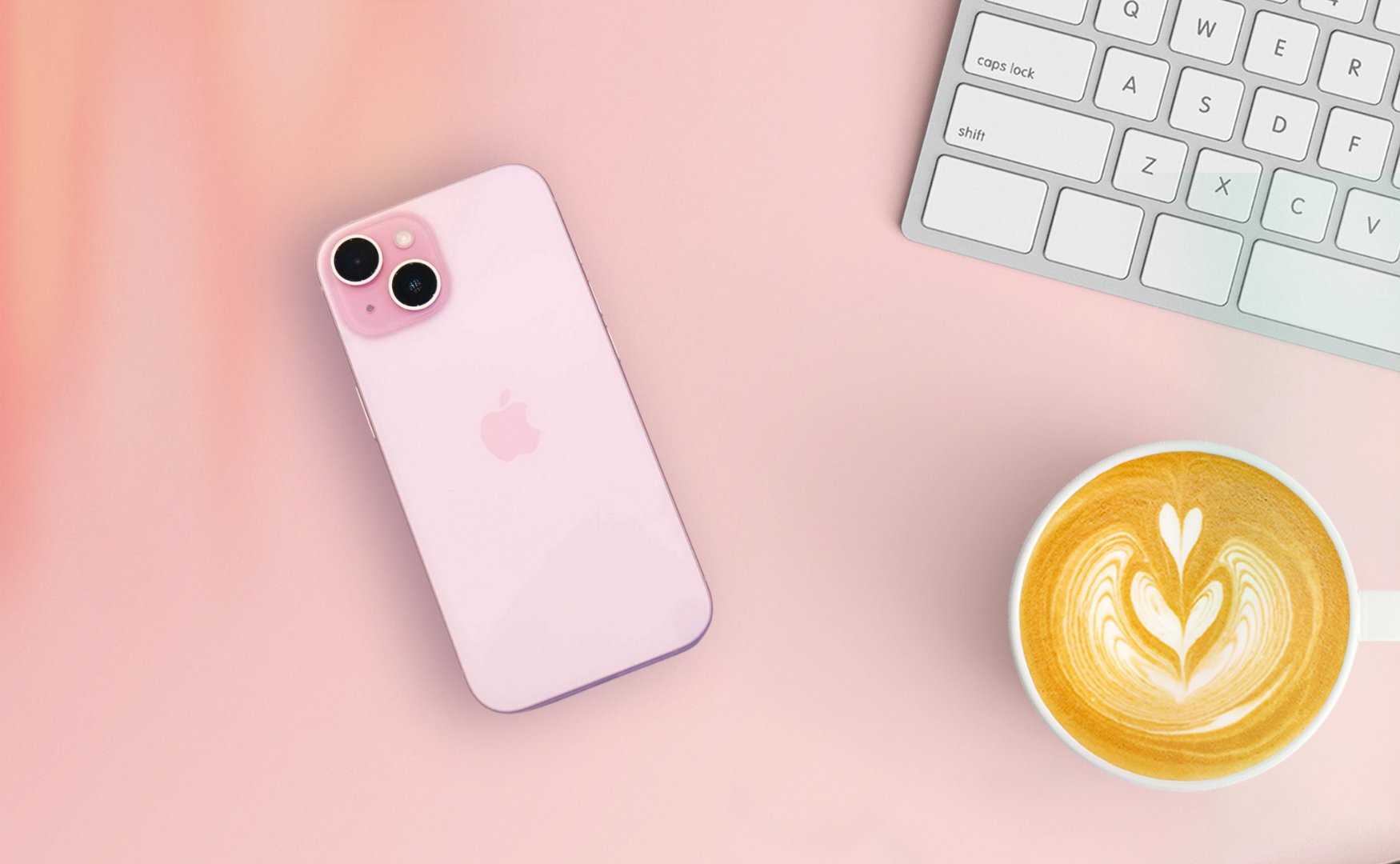 Iphone 15 in pink on pink desk