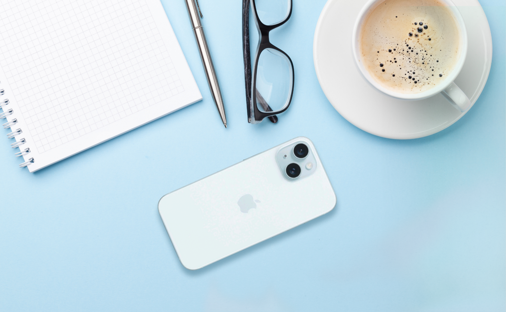 Iphone 15 blue on blue desk
