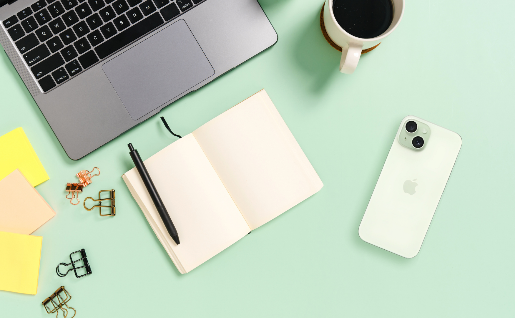Iphone 15 colours: green on mint green desk