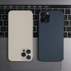Are Refurbished Phones Worth It? Cost, Reliability &Amp; Performance Explained Two refurbished iphones, cream and dark blue, side by side on a laptop
