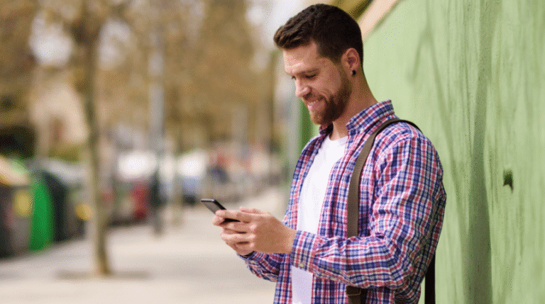 Man happy using fast refurbished phone