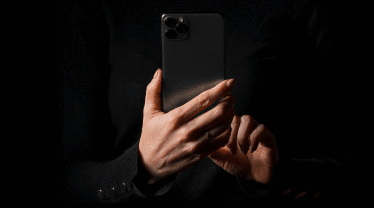 Private mysterious woman doing iphone privacy hack