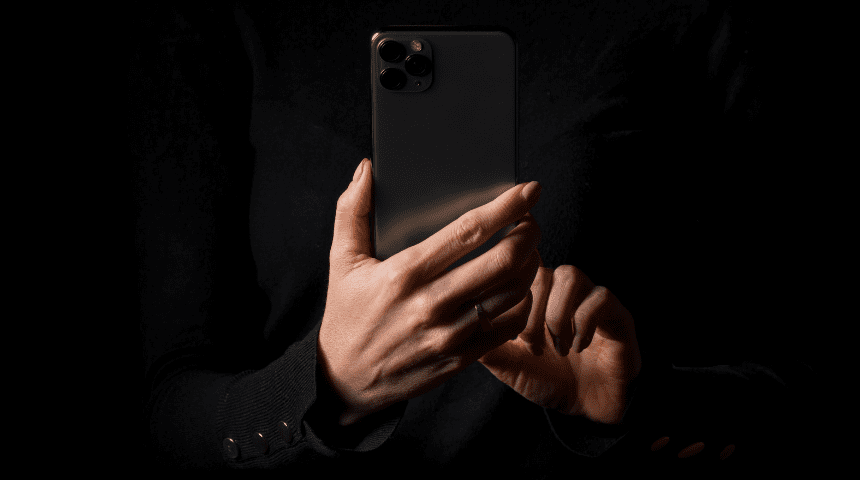 Private mysterious woman doing iphone privacy hack