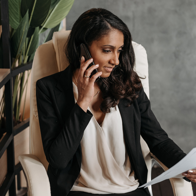 Fraud Prevention &Amp; Device Ownership Policy (For Trade Ins) Lawyer on phone checking papers