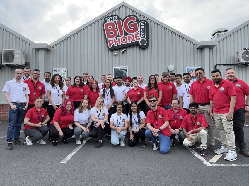 The Big Phone Store team standing together in front of the office.